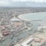 Elmina Castle Harbor Wide Shot Boats Shoreline